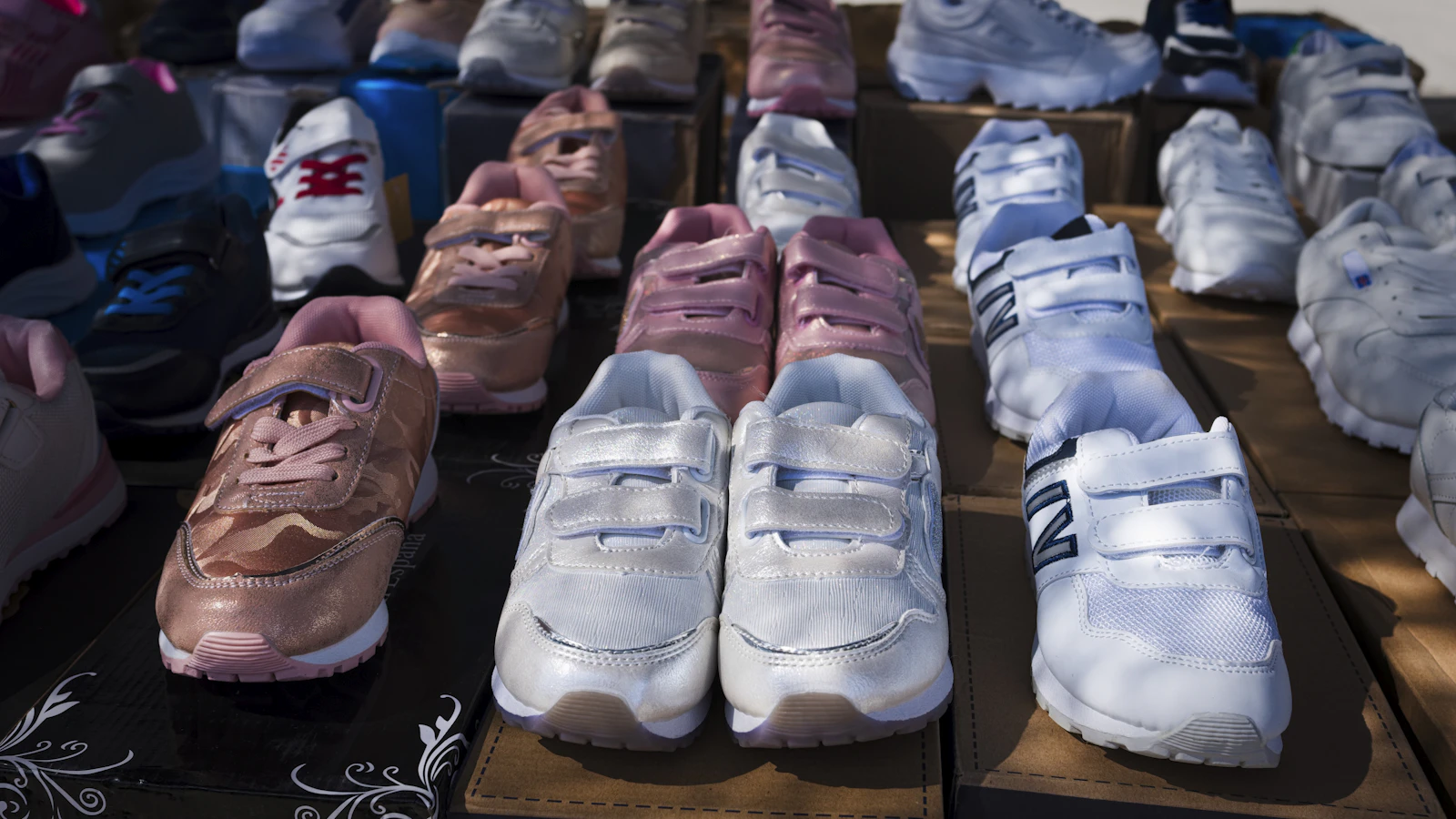 Rows of children’s shoes prepared for distribution