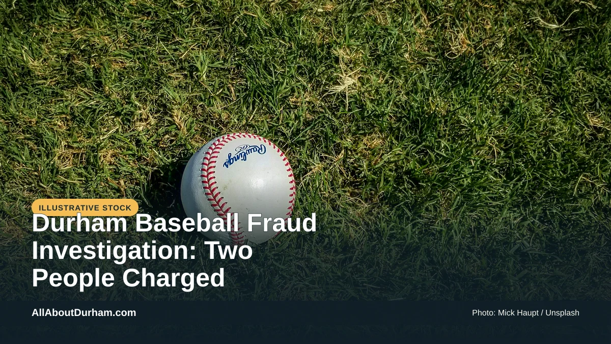 Illustrative stock photo: A baseball on grass at a field. Photo by Mick Haupt on Unsplash. Headline: Durham Baseball Fraud Investigation: Two People Charged. AllAboutDurham.com.